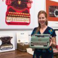 Marler with Royal vintage typewriter donated to the Smithsonian Museum of American History.