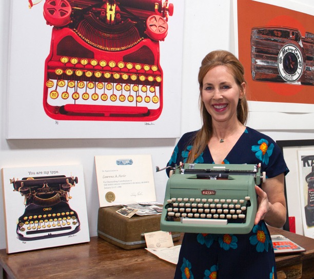 Marler with Royal vintage typewriter donated to the Smithsonian Museum of American History.